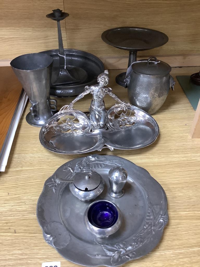 Tudric pewter wares - a Rose Bowl, a comport, a jar and cover, a vase and a three-piece cruet set and other Arts and Crafts and Art Nouveau pewter wares